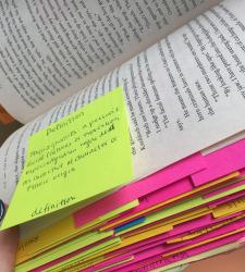 The image shows coloured sticky-notes added to a novel, demonstrating annotations.